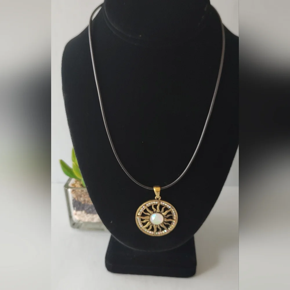 Radiant Gold Sunburst Necklace with Central Gem